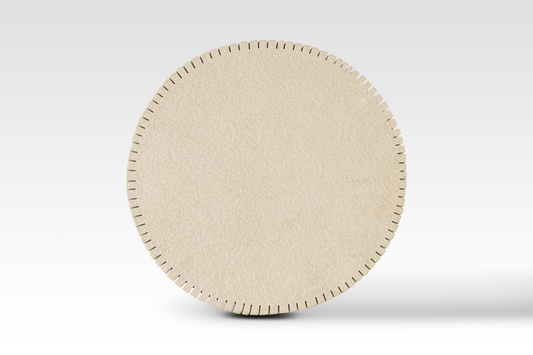 A perfectly circular overhead view of the Oasis End Table’s notched edge sandstone top, showcasing the architectural 'cog-style' perimeter and natural stone texture.