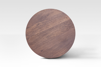 A perfectly circular overhead view of the Orbit End Table, showcasing the rich walnut finish and natural grain variations of the solid mango wood surface.