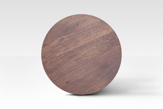 A perfectly circular overhead view of the Orbit End Table, showcasing the rich walnut finish and natural grain variations of the solid mango wood surface.
