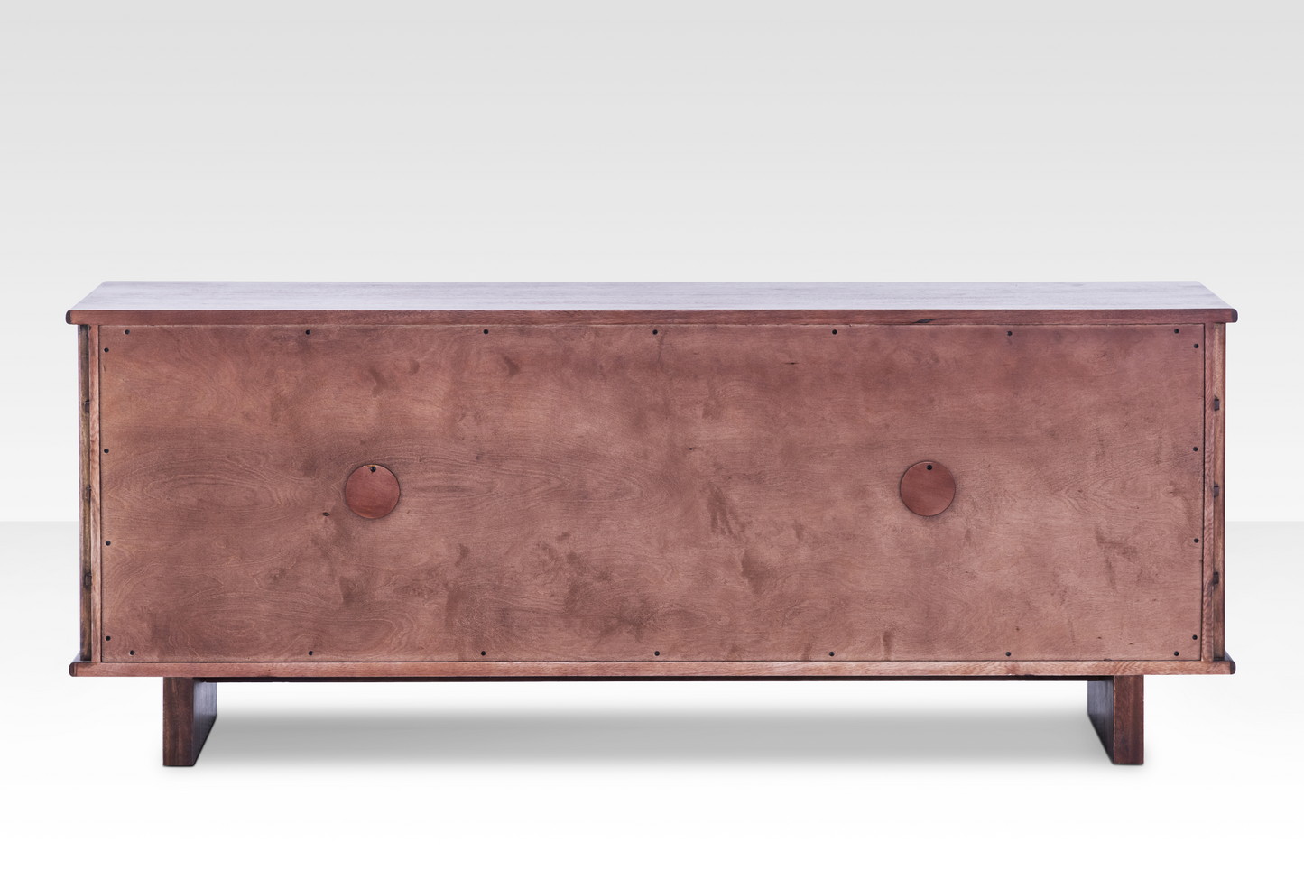 Rear view of the finished Quattro Sideboard back panel, featuring dual circular media cutouts for organized cable management.