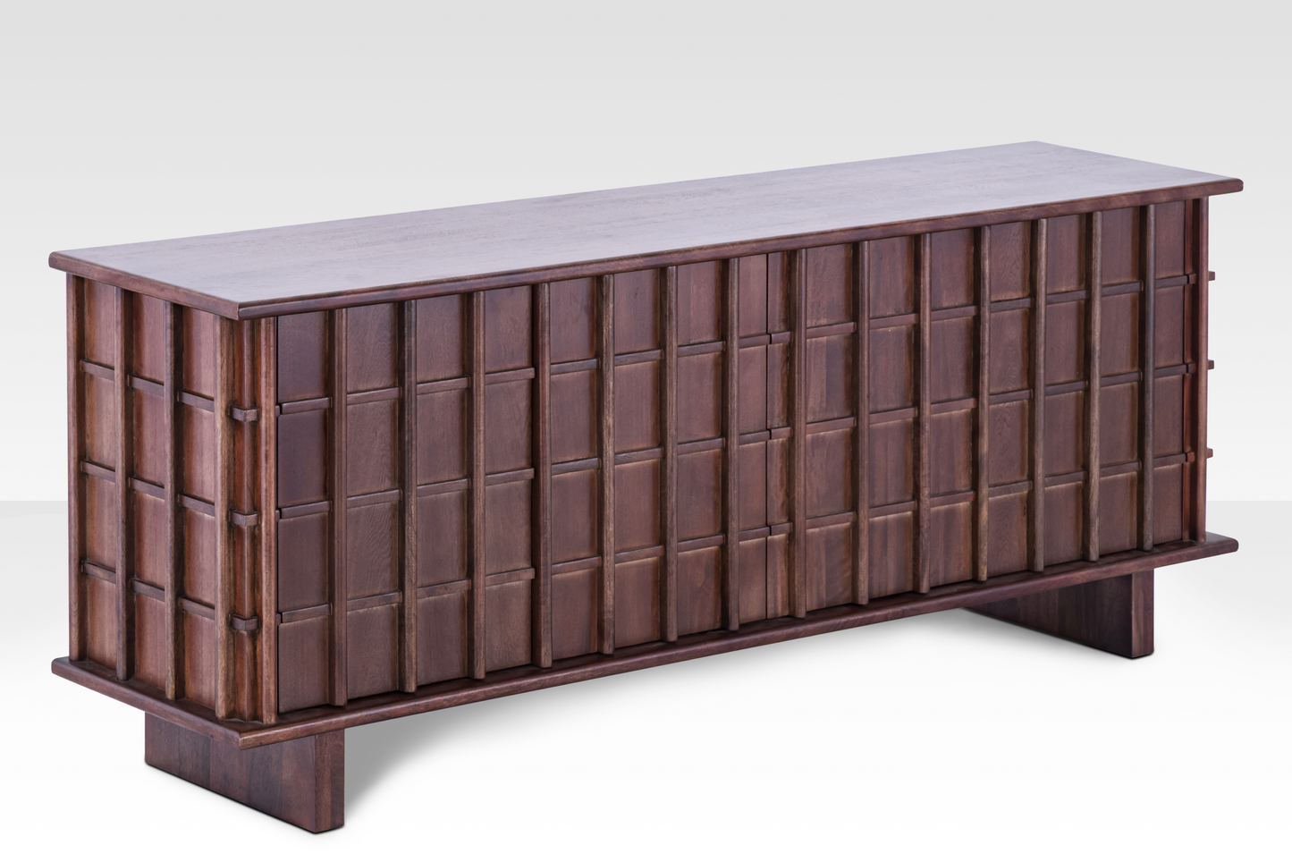Angled perspective of the Quattro Sideboard showing the three-dimensional texture of the door panels and substantial wood thickness.