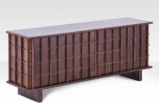 Angled perspective of the Quattro Sideboard showing the three-dimensional texture of the door panels and substantial wood thickness.