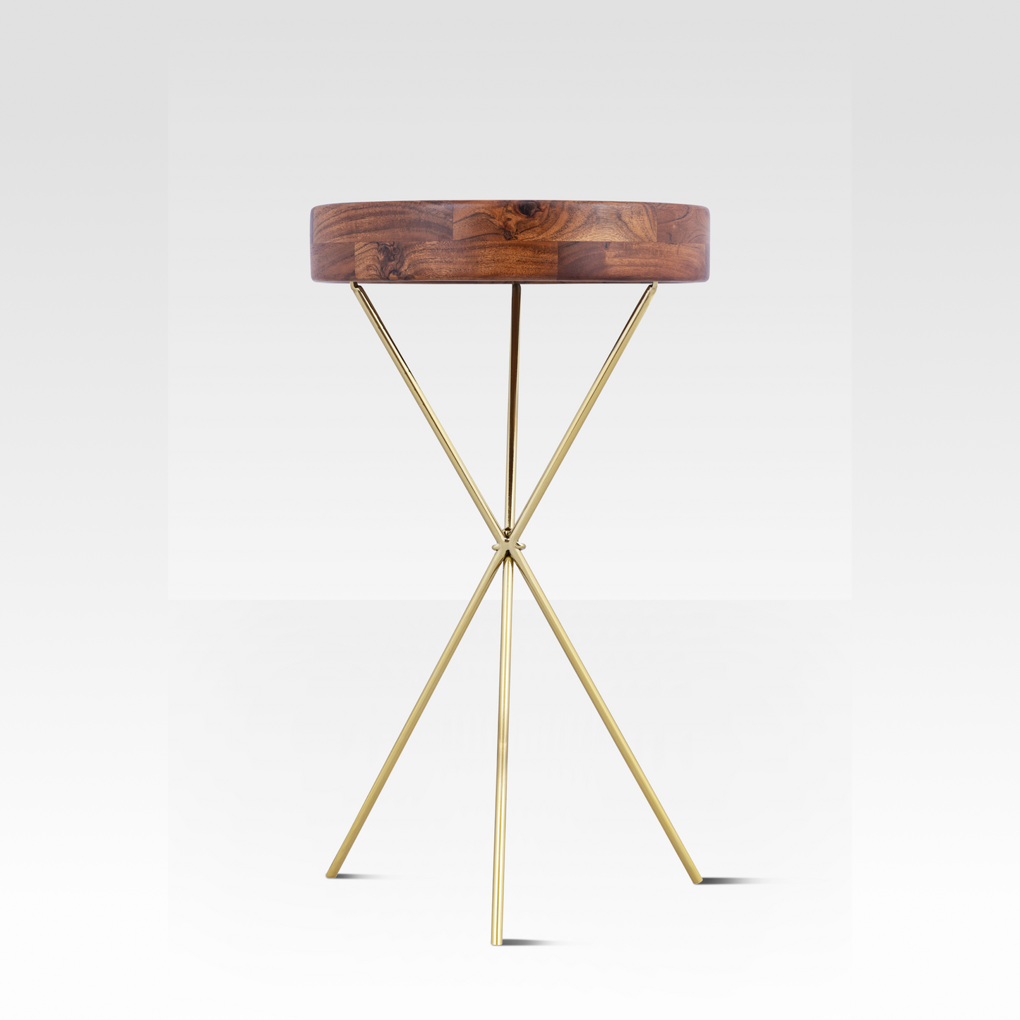 An angled view of the Quill End Table featuring a deep solid mango wood tray top resting on a minimalist gold tripod base.