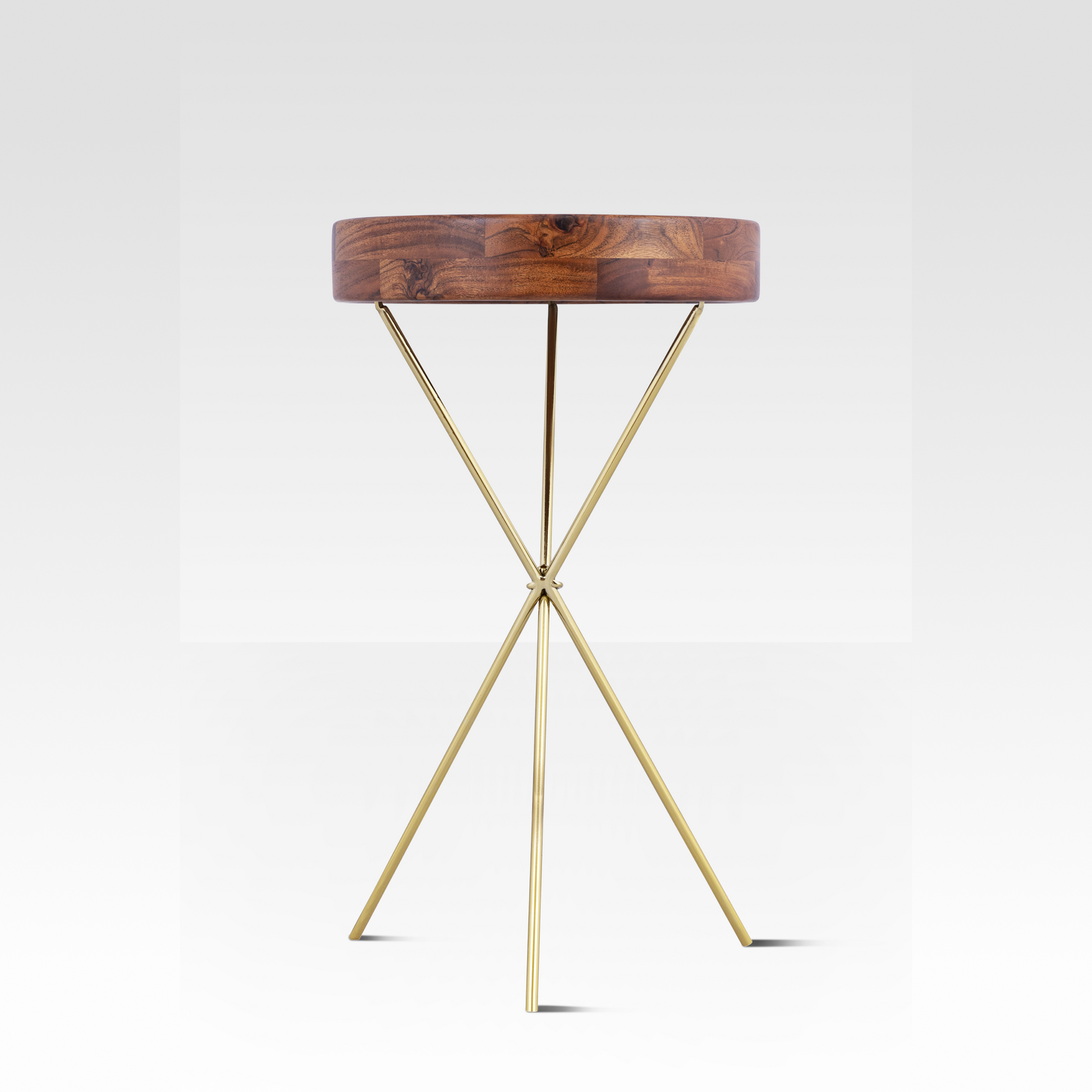 An angled view of the Quill End Table featuring a deep solid mango wood tray top resting on a minimalist gold tripod base.