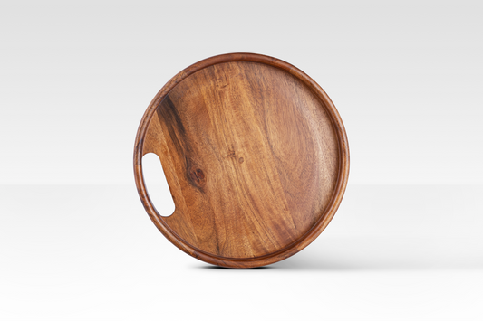 A circular overhead view of the Quill removable tray top, handcrafted from solid mango wood with an integrated handle and natural grain finish.