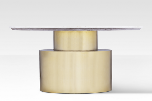 A straight-on profile of the Ray Coffee Table highlighting the architectural two-tier stepped brass base and slim marble top.