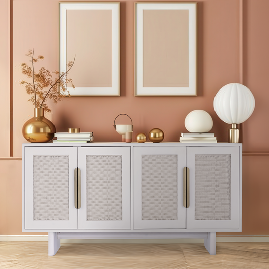 The white-washed Riva Sideboard styled against a warm peach accent wall, showcasing its versatile color palette.
